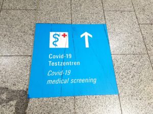Signage at Frankfurt airport guiding visitors to COVID-19 testing center. 