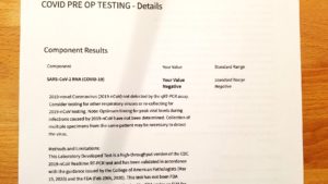Printout results of negative COVID PCR test, required 72 hours before flying internationally.